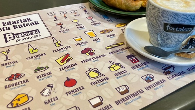 Euskeraz Primeran! mantelak tabernetan, eta ohar- laburretarako talonarioak dendetan